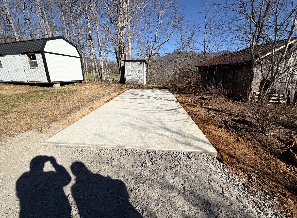Finished concrete driveway with a mountain backdrop