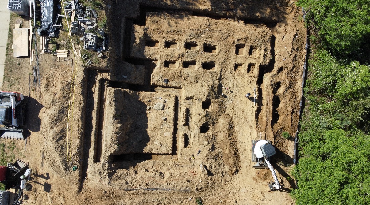 Aerial view of an active dig site with equipment